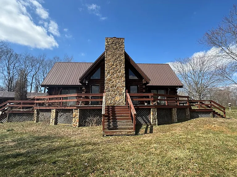 Rustic Log Cabin Home on 10 Acres with Barns & Workshop – Endless Potential! | $249,900.