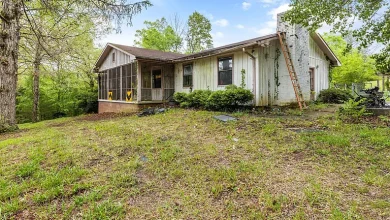 Photo of $224,900 – 4-Bedroom Home with Basement Apartment on 6.5 Wooded Acres in Ten Mile, TN