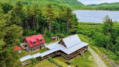 Photo of $208.999 – Log Chalet with Pond Views, Garage & Income Potential