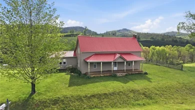 Photo of $274.900 – Classic Farmhouse on 6 Acres with Barn & Pond in Laurel Springs, NC